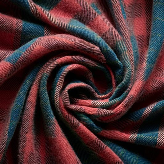 Rustic Strength, photographic image of red-dominant plaid flannel fabric bunched into a spiral