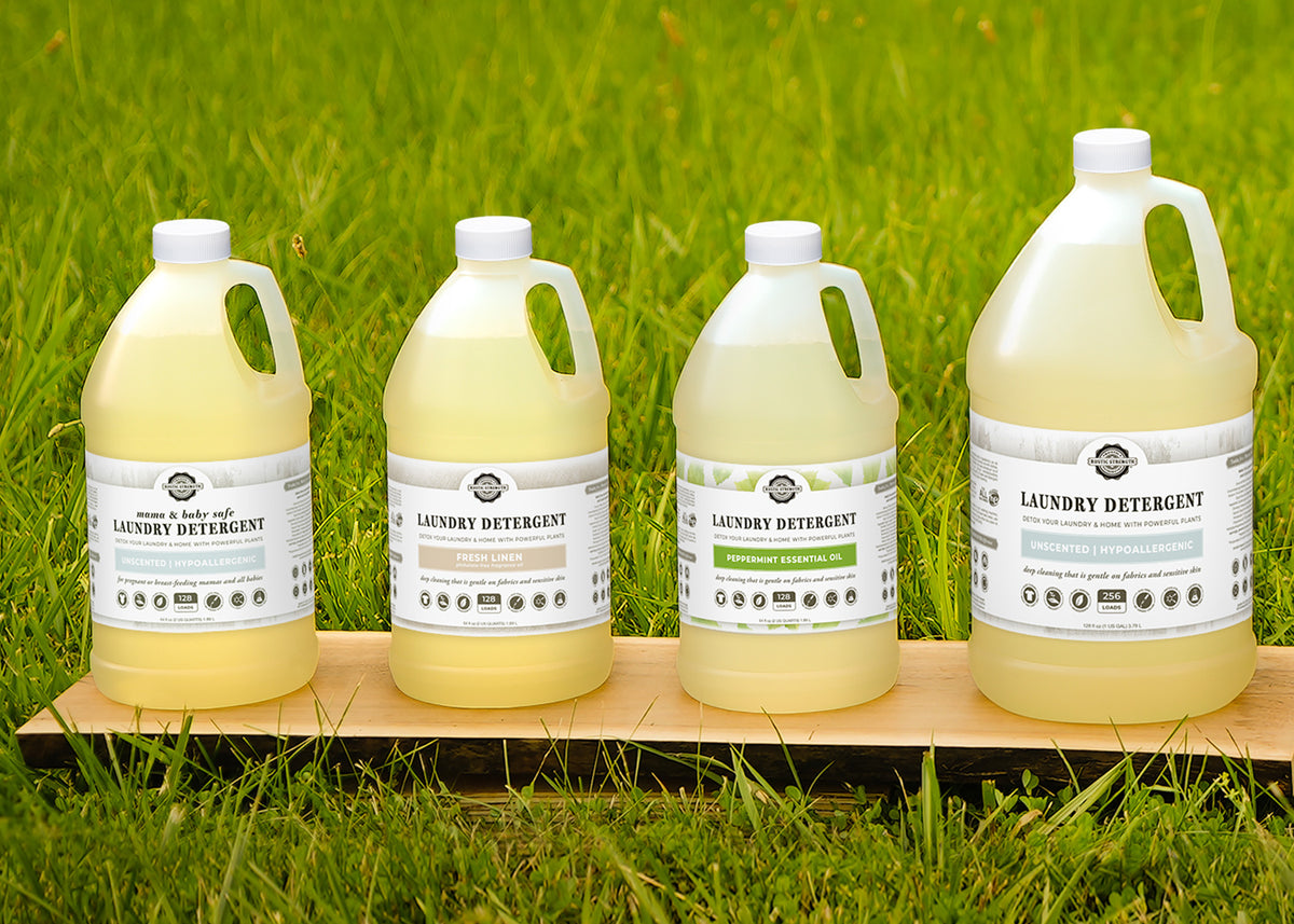 Rustic Strength, photoshoot image of 4 Plastic Jugs set on a wooden plank in the grass
